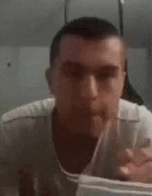 a blurry picture of a man in a white shirt dancing