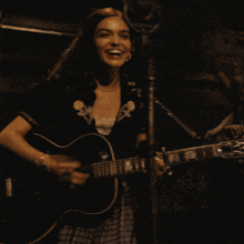 Playing Guitar Lucy Gray Baird GIF - Playing Guitar Lucy Gray Baird Rachel Zegler GIFs