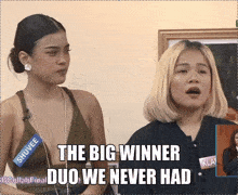 two women are standing next to each other and one of them is wearing a name tag that says shuvee