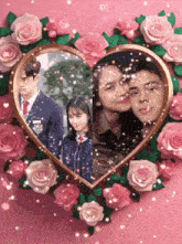 a picture of a boy and a girl in a heart surrounded by roses