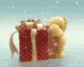 a teddy bear is sitting next to two christmas presents