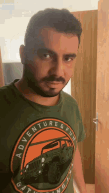 a man wearing an adventure and fun t-shirt