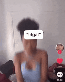 a blurry picture of a woman with a sticker that says " idgaf " on her face