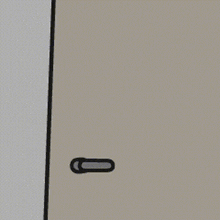a cartoon character is peeking out from behind a door with a door handle .