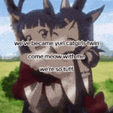 two anime girls are hugging each other and one of them is holding a cat .