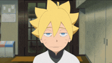 a boy with yellow hair and blue eyes looks tired
