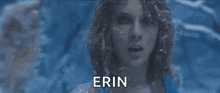 a close up of a woman 's face with the name erin written on it .