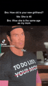 a man wearing a black shirt that says to do list your mom on it
