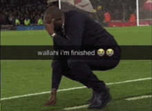 a man kneeling down on a soccer field with the words wallahi i 'm finished