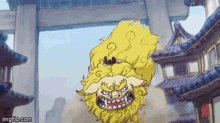 a cartoon of a yellow lion standing in front of a building with buildings in the background .