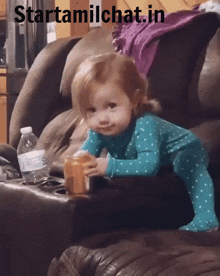 a little girl is sitting on a couch with the words starttamilchat.in written above her