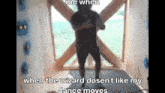 a man is standing in front of a window in a room with a blurred image of him .