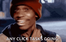 a man in a red hat is smiling and asking if any click tasks are going .