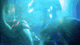 a painting of a person swimming in a blue ocean