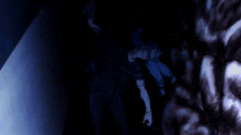 a dark room with a blue light shining through a broken glass window