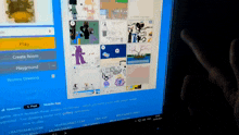 a person is playing a game on a computer screen that says play on it