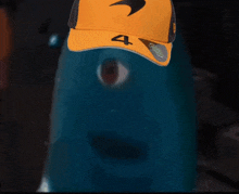 a person wearing a yellow hat with the number four on it