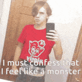 a boy is taking a selfie in a mirror while wearing a red shirt that says vipps