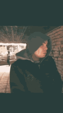 a man in a hooded jacket with the words pa dal written on the bottom