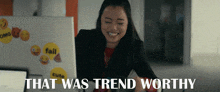 a woman sitting in front of a computer with the words that was trend worthy on the bottom
