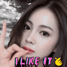 a girl is making a peace sign and the words i like it are next to her