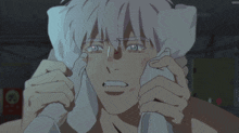 a man with a towel around his neck is crying in a cartoon