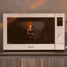 a panasonic microwave with a picture of a woman on it