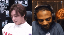 a man wearing headphones is sitting in front of a sign that says station n