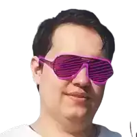 a man wearing a pair of pink sunglasses against a white background