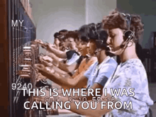 a row of women wearing headsets are working on a telephone switchboard .