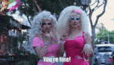 two drag queens are standing next to each other and one says you 're fine