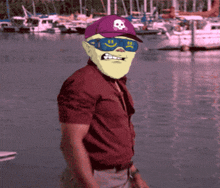 a man wearing a purple hat with a skull on it