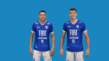 two soccer players wearing blue shirts that say fly minas on them