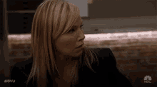 a close up of a woman 's face with #svu on the bottom