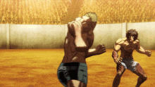 two men are fighting in front of a crowd in a boxing ring