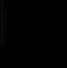 a close up of a plane 's wing in the dark with a black background .