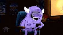 a purple monster is sitting in a chair playing a video game with a controller .
