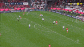 a soccer game is being played on a sports tv channel