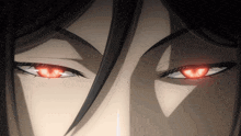 a close up of a person 's eyes with red irises