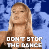 a woman says " do n't stop the dance " in front of a crowd of people