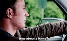 a man is driving a car and talking to another man in the car .