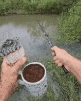 a person holding a fishing rod next to a mug that says " as vezes da vitoria "