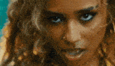 a close up of a woman wearing hoop earrings
