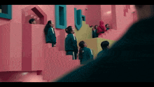a group of people are standing on a set of stairs and one has the number 30 on her uniform