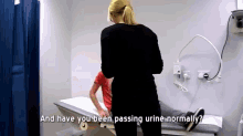 a doctor asks a patient if they have been passing urine