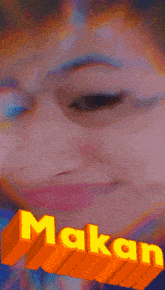 a close up of a woman 's face with the word makan in yellow