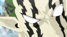 a close up of a person 's face with white eyes and black stripes