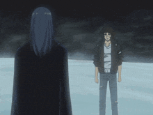 a man and a woman standing next to each other