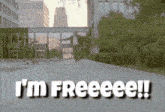 a man is walking down a street with the words i 'm freeeeee