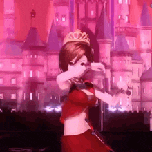 a girl in a red dress is dancing in front of a castle .